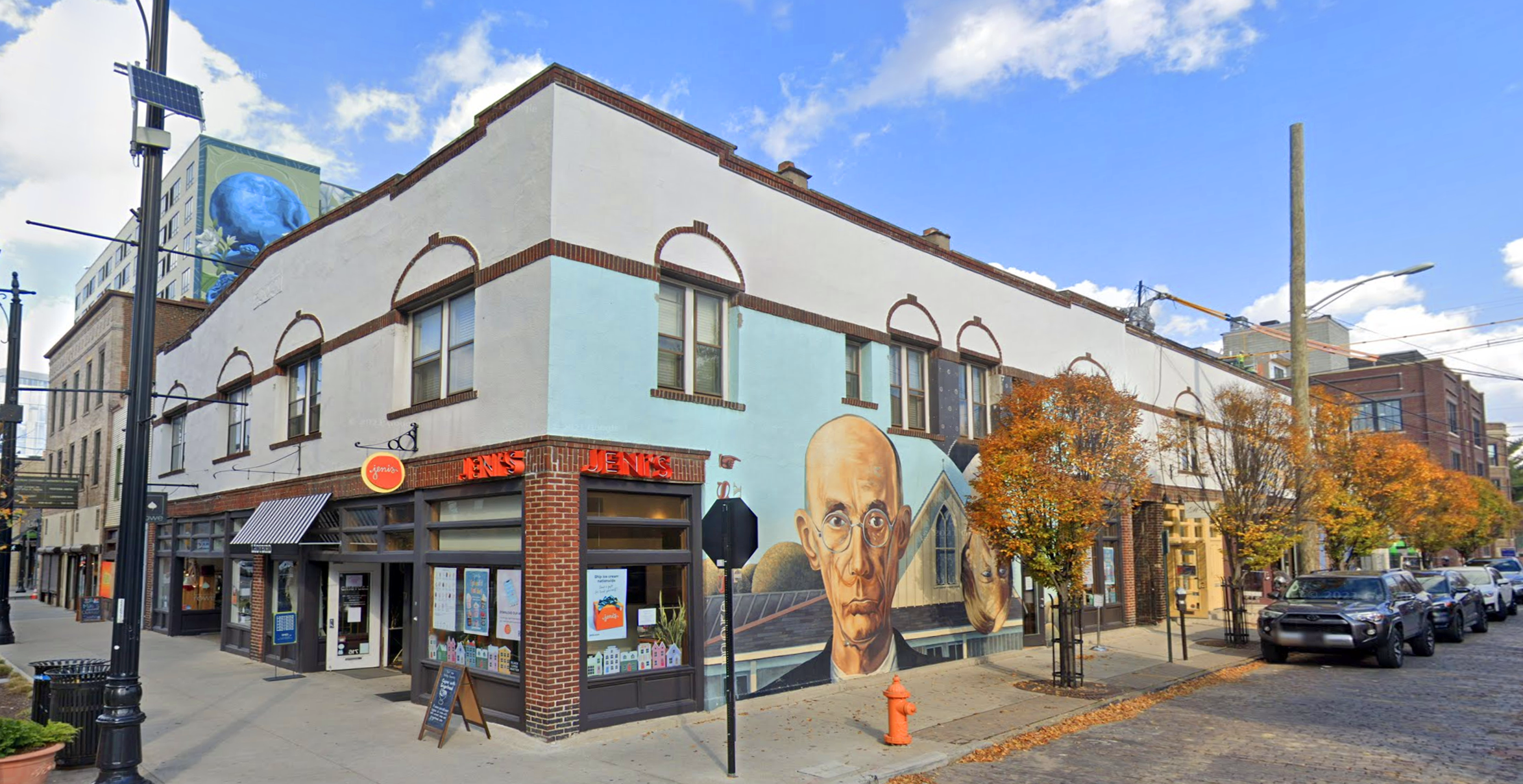 A building with a mural on the side of it.